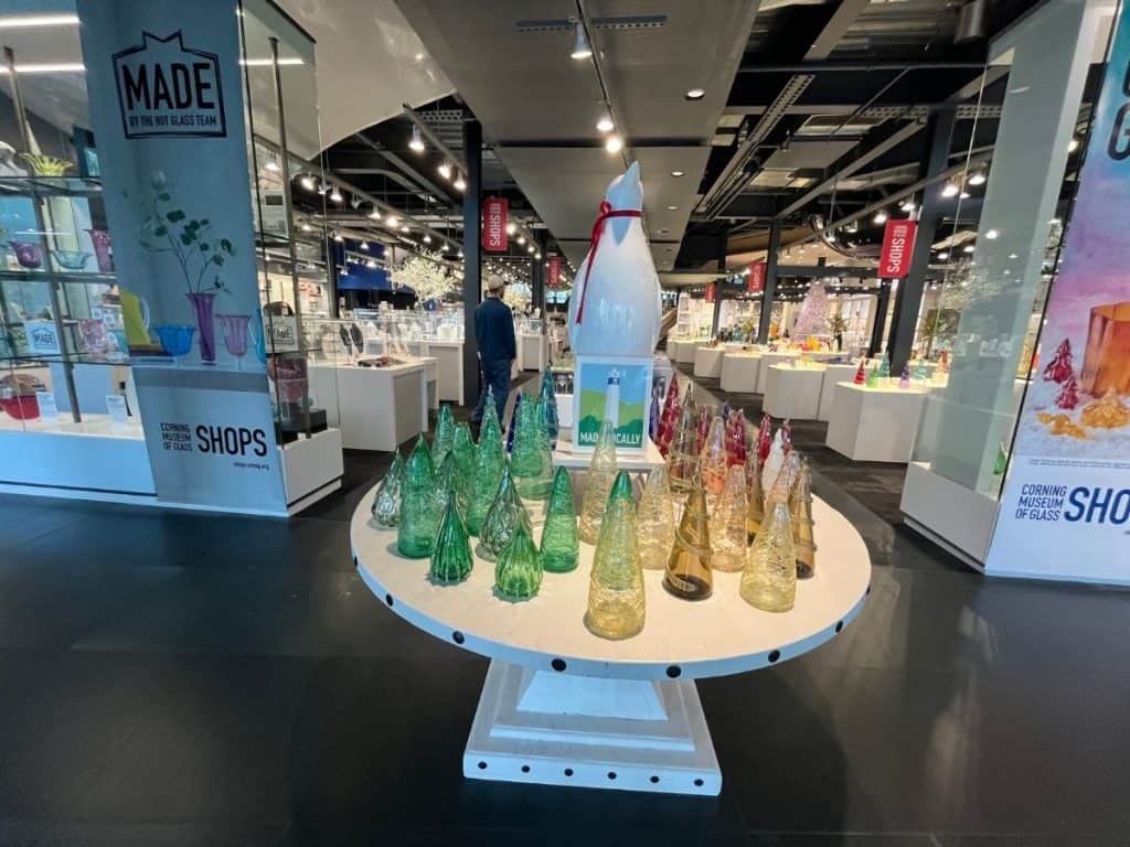 Brightly colored glass trees are on display in a modern exhibit area at the Corning Museum of Glass gift shop called the Shops.