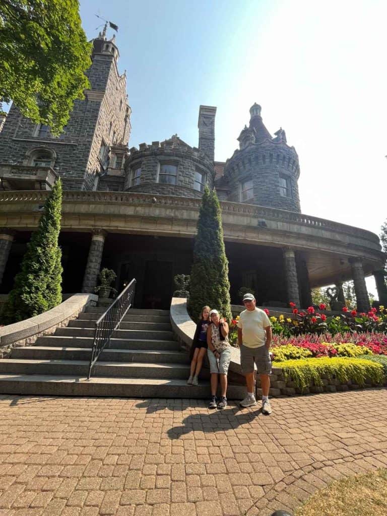 Grandparents and child in front of Boldt Castle on Heart Island for a Thousand Islands 1 Day Itinerary.