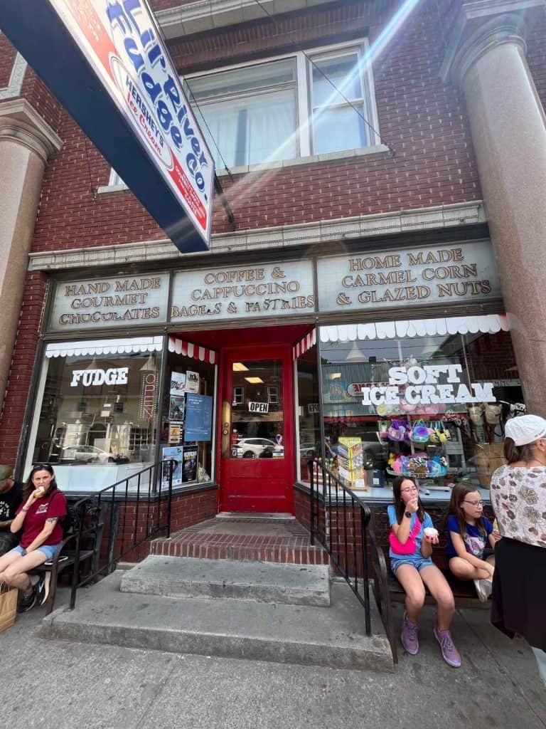 Family eating ice cream in front of an ice cream shop in downtown Alexandria Bay NY